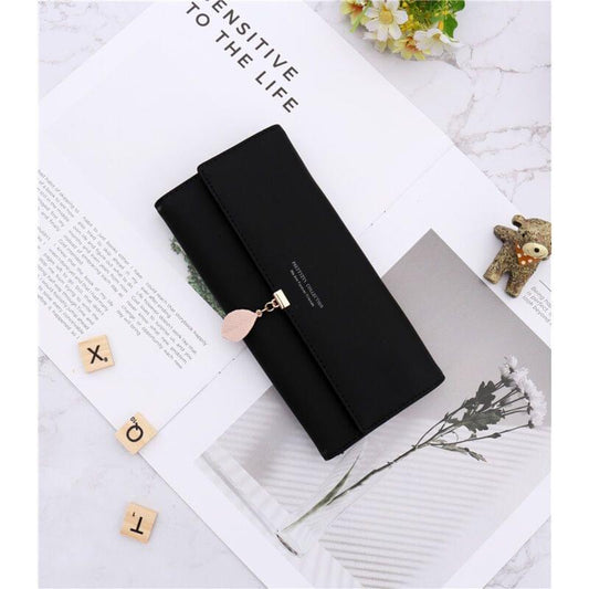 Black wallet-style storage bag with front flap and pink key-charm clasp