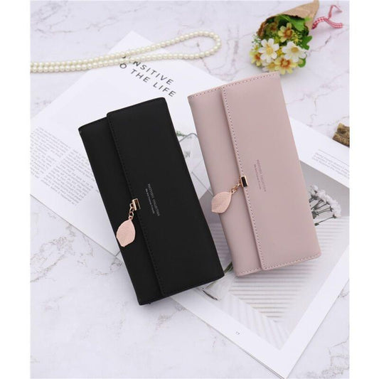 Black and blush wallet-style storage bags with front flap and pink heart charm