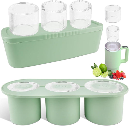 Green silicone ice cube tray with lid and bin, showing three round ice molds