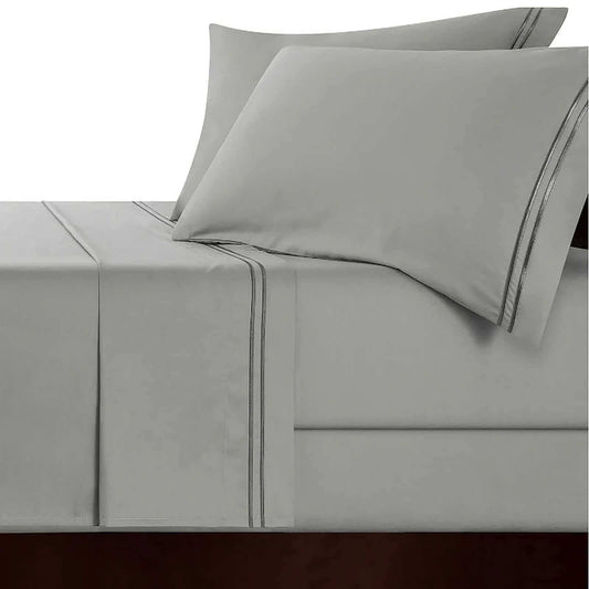 Charcoal gray sheet set with silver stripe piping and matching pillowcase