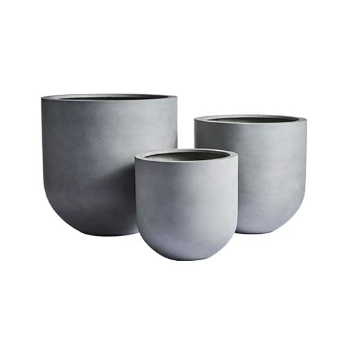 Three matte gray round planter pots of different sizes, no plants shown.