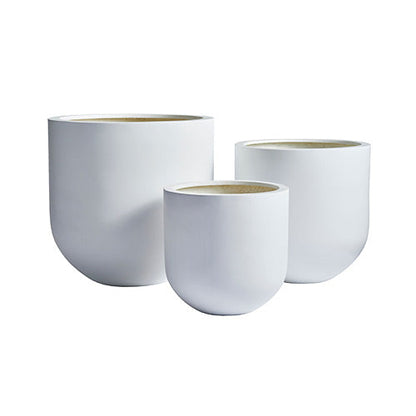 White planter trio with three round pots in graduating sizes and light interior bottoms