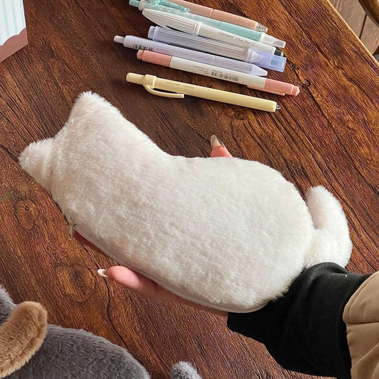 White plush cat-shaped pencil case with zipper, held in hand