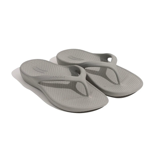 Pair of grey orthotic thong sandals with curved V straps and textured sole
