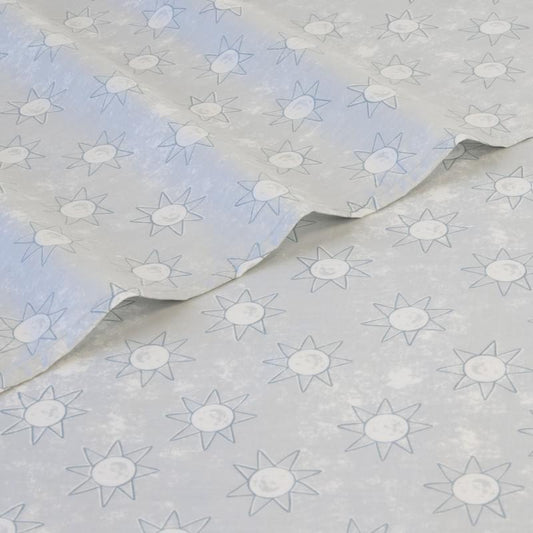 Single sheet set in light blue-gray with repeating star and sun motifs