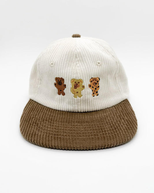 Bikkie cub mini lid cap with white knit crown, brown cord brim, three bear patches
