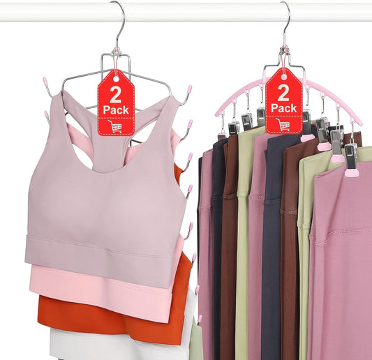 Pink multi-hanger rack holding folded camisoles and workout tops with clips
