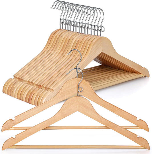 Light wood coat hangers with metal hook, notched shoulders, and pants bar