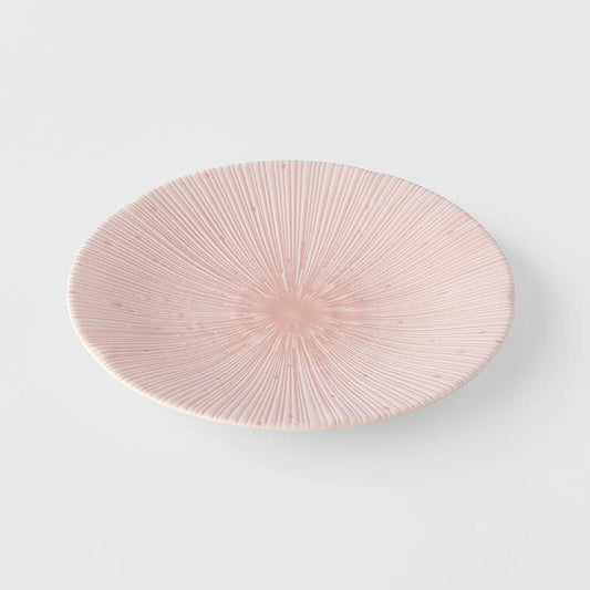 Pink glazed tapas plate with radial ridges and starburst center
