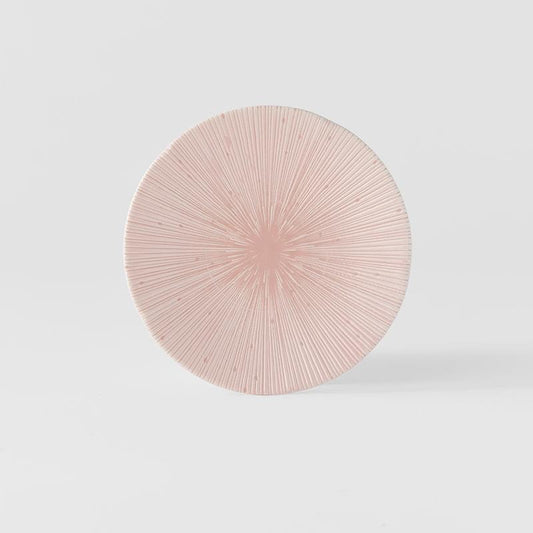 Pink round tapas plate with fine radial line texture and glossy starburst center