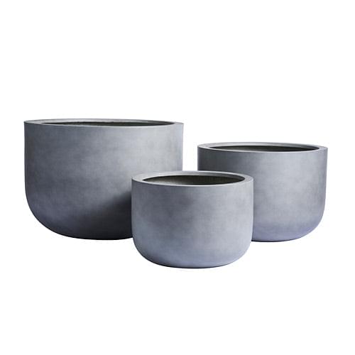 Concrete grey planter pot set of three with round shapes and smooth sides
