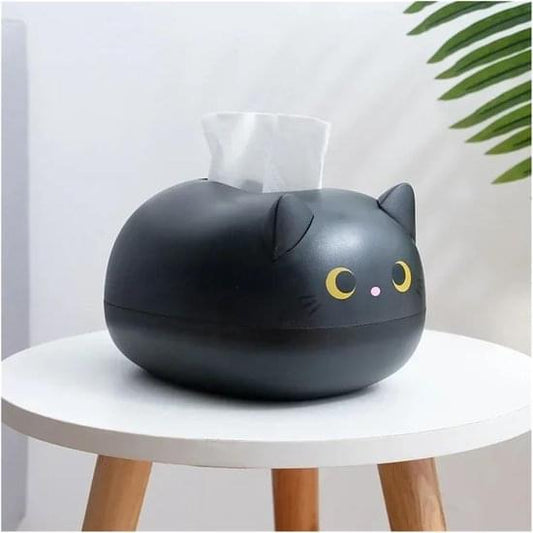Black cat-shaped tissue box holder with tissue emerging and cartoon face