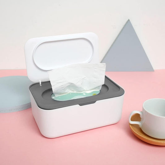 White tissue dispenser box with gray base, open lid, and tissues pulled out