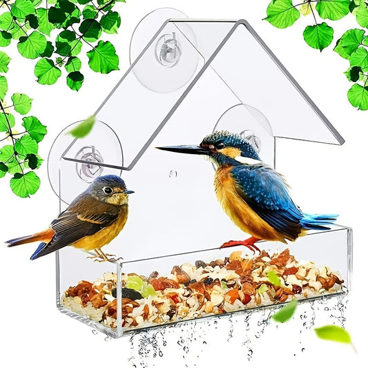 Clear birdhouse feeder with roof and two circular openings, filled with seed