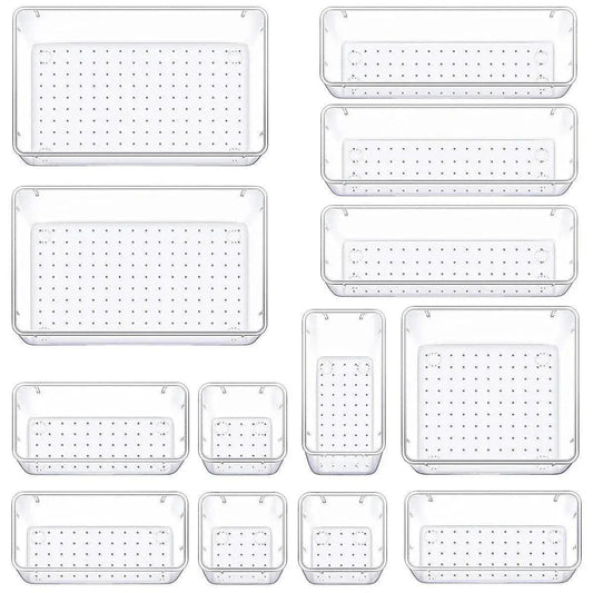 Clear plastic drawer organizers with perforated bases, nested in multiple sizes