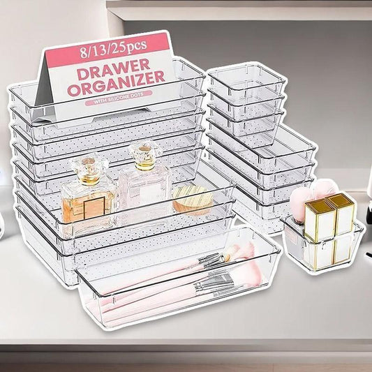 Clear stacked drawer organizer trays on a tabletop, 8/13/25-piece option shown