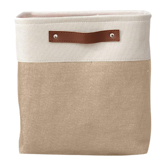 Cream-and-beige fabric storage bag with leather handle tabs, front close-up