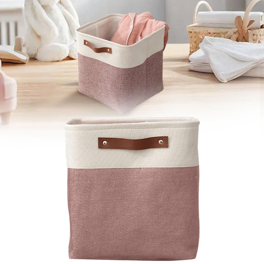 Two-tone fabric organizer bag with cream rim, pink body, and brown leather handle strap