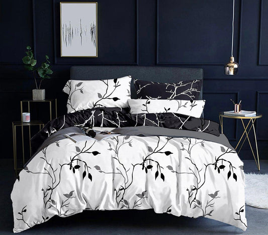 Reversible double quilt/duvet set with white side and black tree branch print, pillows
