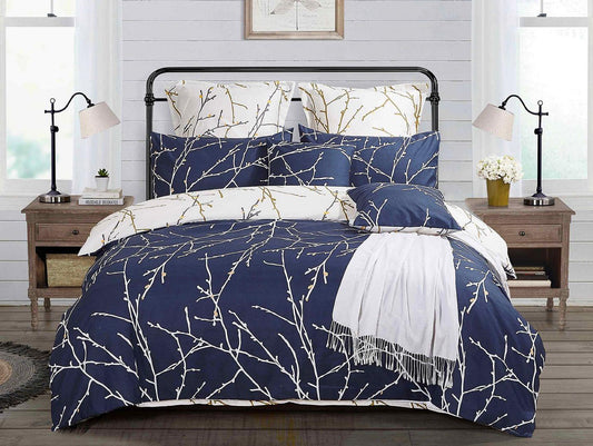 Reversible queen quilt cover set in navy and cream tree-branch pattern on bed