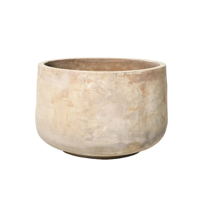 Round stone-look planter pot in light beige with textured surface