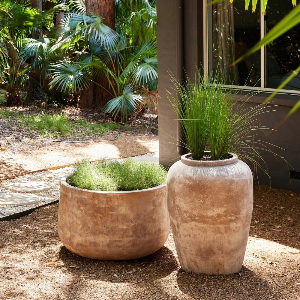 Two stone-textured planter jars with flared rims, light tan and off-white finishes.