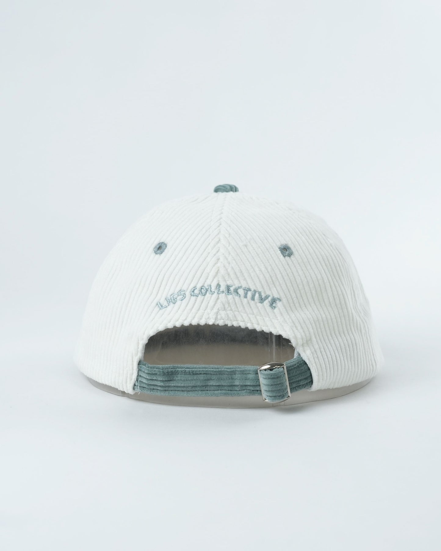 Troopy hat back view with white ribbed fabric and teal adjustable strap.