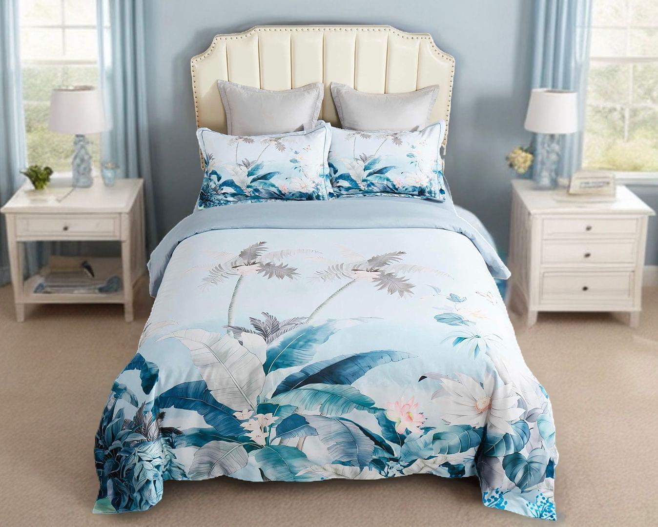 Tropical quilt cover set with blue and white palm and floral print, includes pillowcases