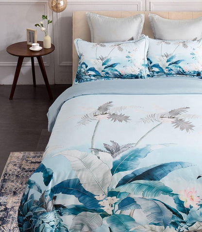 Tropical quilt cover set with blue and white palm leaf duvet and two matching pillowcases