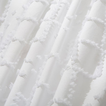 White quilt fabric with embroidered tufted diamonds and soft fringe trim