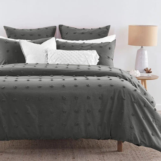 Grey tufted dot jacquard duvet cover set with pillows, bed-ready view