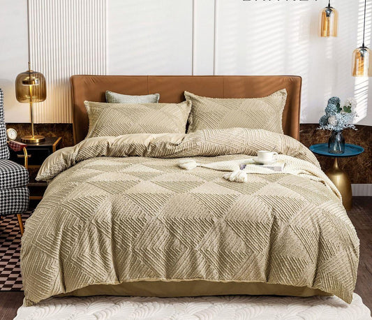 Super king quilt cover set with geometric jacquard weave, shown on a made bed
