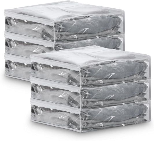 Clear vinyl zipper storage bags, stacked with zippers, holding folded gray sweaters