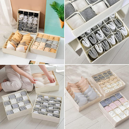 Beige and white drawer organizer grids holding folded socks and shirts