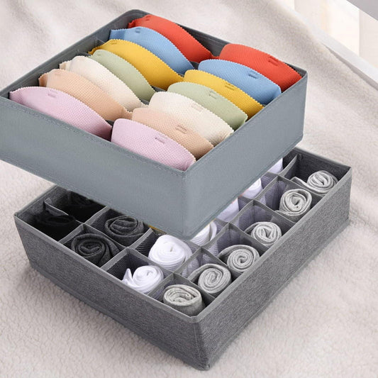 Gray fabric drawer organizer with handle, divided cells holding folded socks
