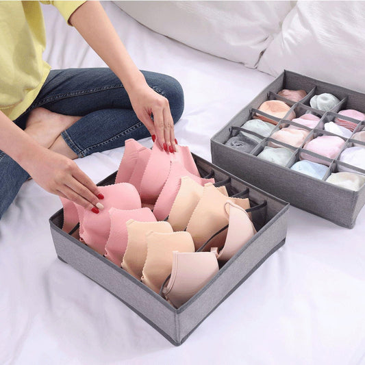 Gray fabric drawer organizer with cells holding folded underwear and socks