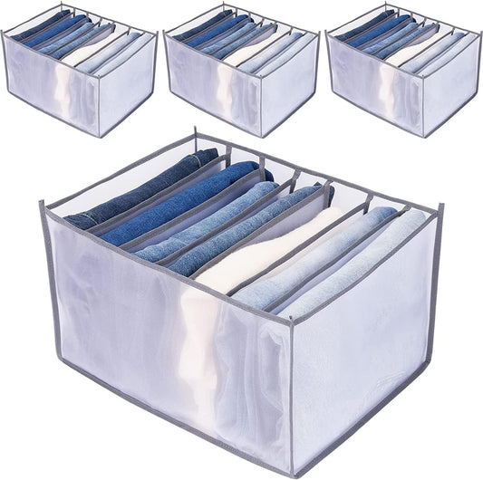 Foldable gray clothes drawer organizer with handle, open cells holding folded jeans
