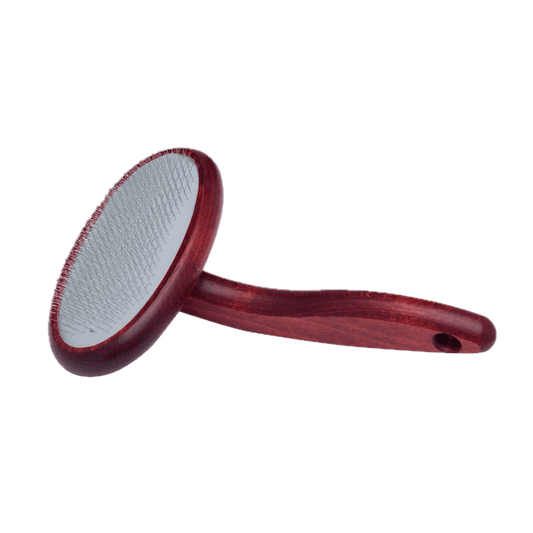 Maroon soft slicker pet brush with rounded pin pad on a wooden handle