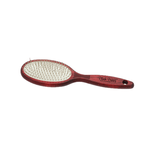 Woodgrain pin brush with red handle and oval base packed with metal pins