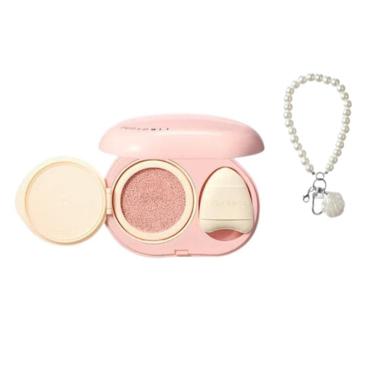 Pink concealer cushion compact with open powder well, spare pad, and pearl chain