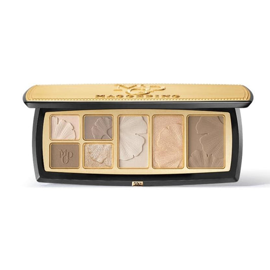 Cosmetic pressed powder palette open, showing light and contour shades in gold-trim case