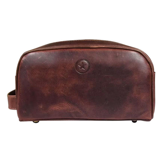 Dark brown leather toiletry bag with front logo medallion and top zipper closure.