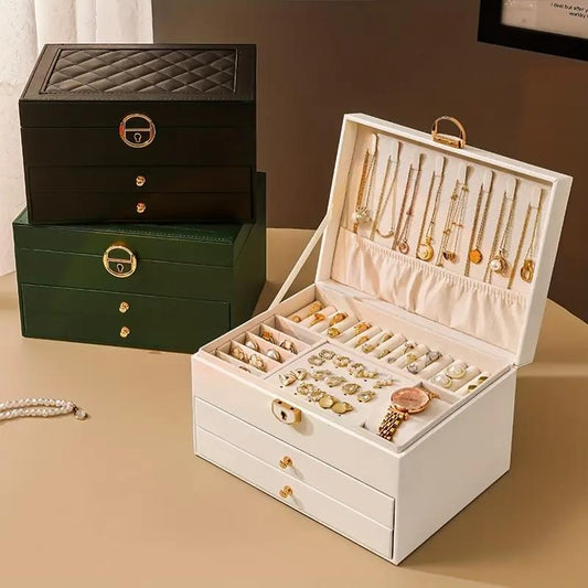 White and dark green jewelry storage box set with open necklace slots and ring trays