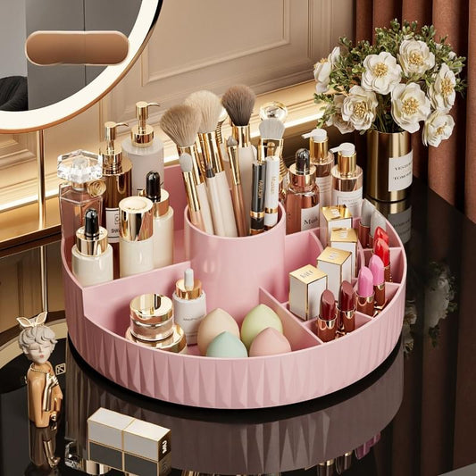 Rotating cosmetics organizer with white outer tray and pink inner ring compartments