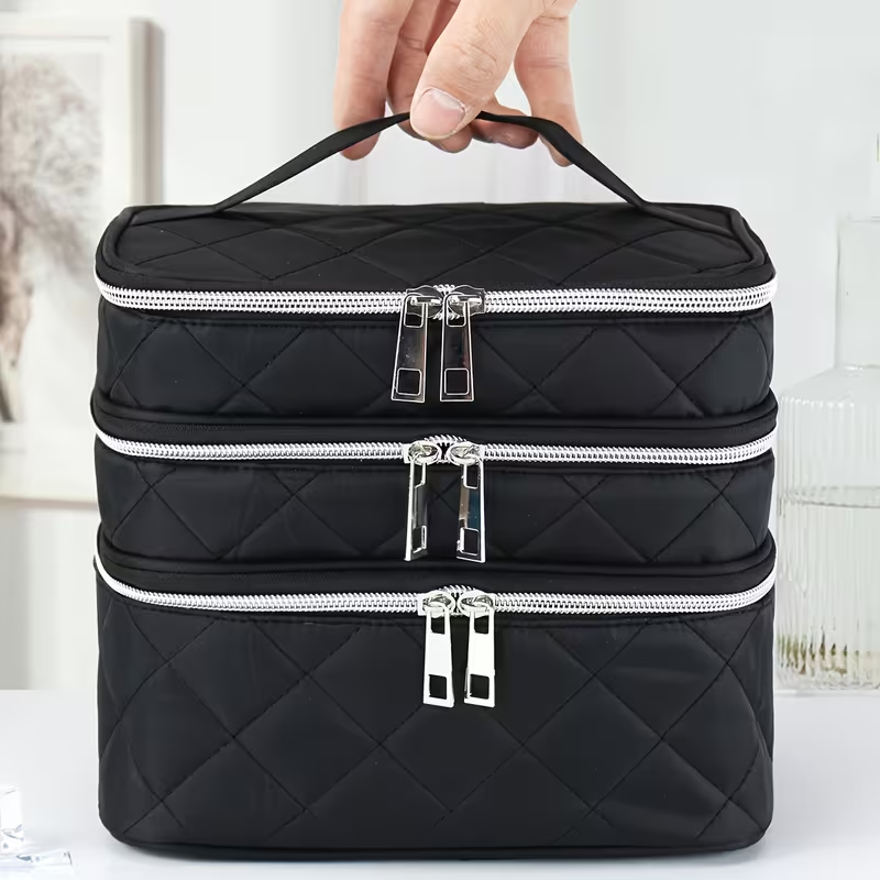Fashionable and light luxury large-capacity black embroidered diamond-shaped cosmetic bag with three  for multi-level storage, portable and hand-held, suitable for home and travel use.
