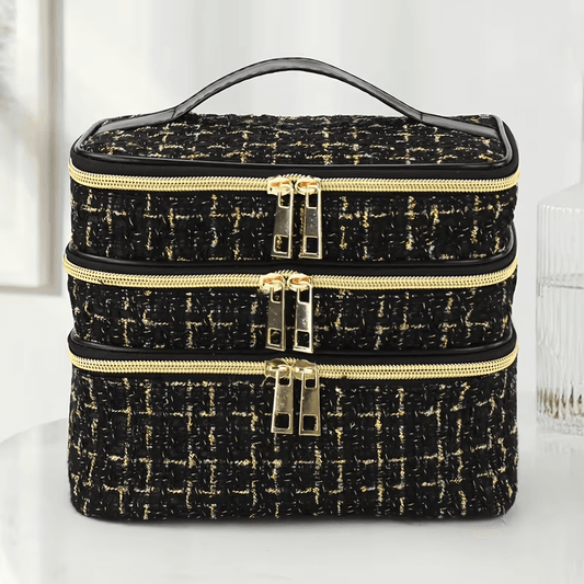 Quilted cosmetic bag with gold-speckled fabric, stacked zip compartments, metal double pulls