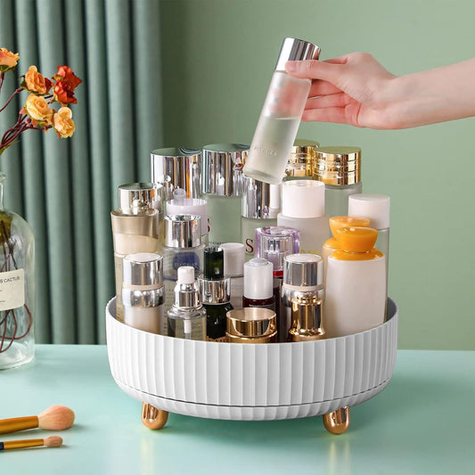 White ribbed 360° cosmetic organizer turntable with gold feet and raised compartments