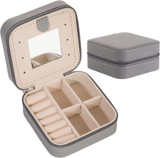 Grey travel jewelry box with mirror, open compartments with ring holders and necklace slots