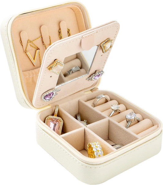 White jewelry travel case with mirror, open compartments and ring slots for bracelets