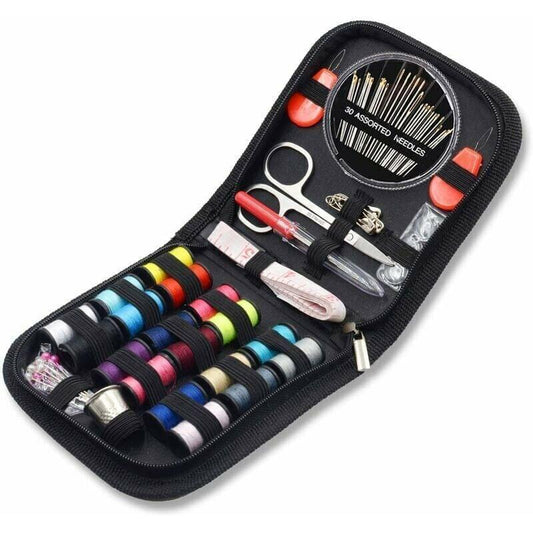 Sewing kit case with thread spools, scissors, needles, seam ripper, and accessories